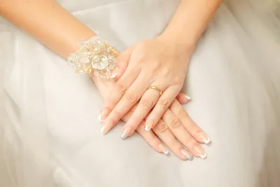 Bride with elegant french manicure wedding nails