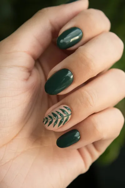 Professional gel manicure with green autumn nail art